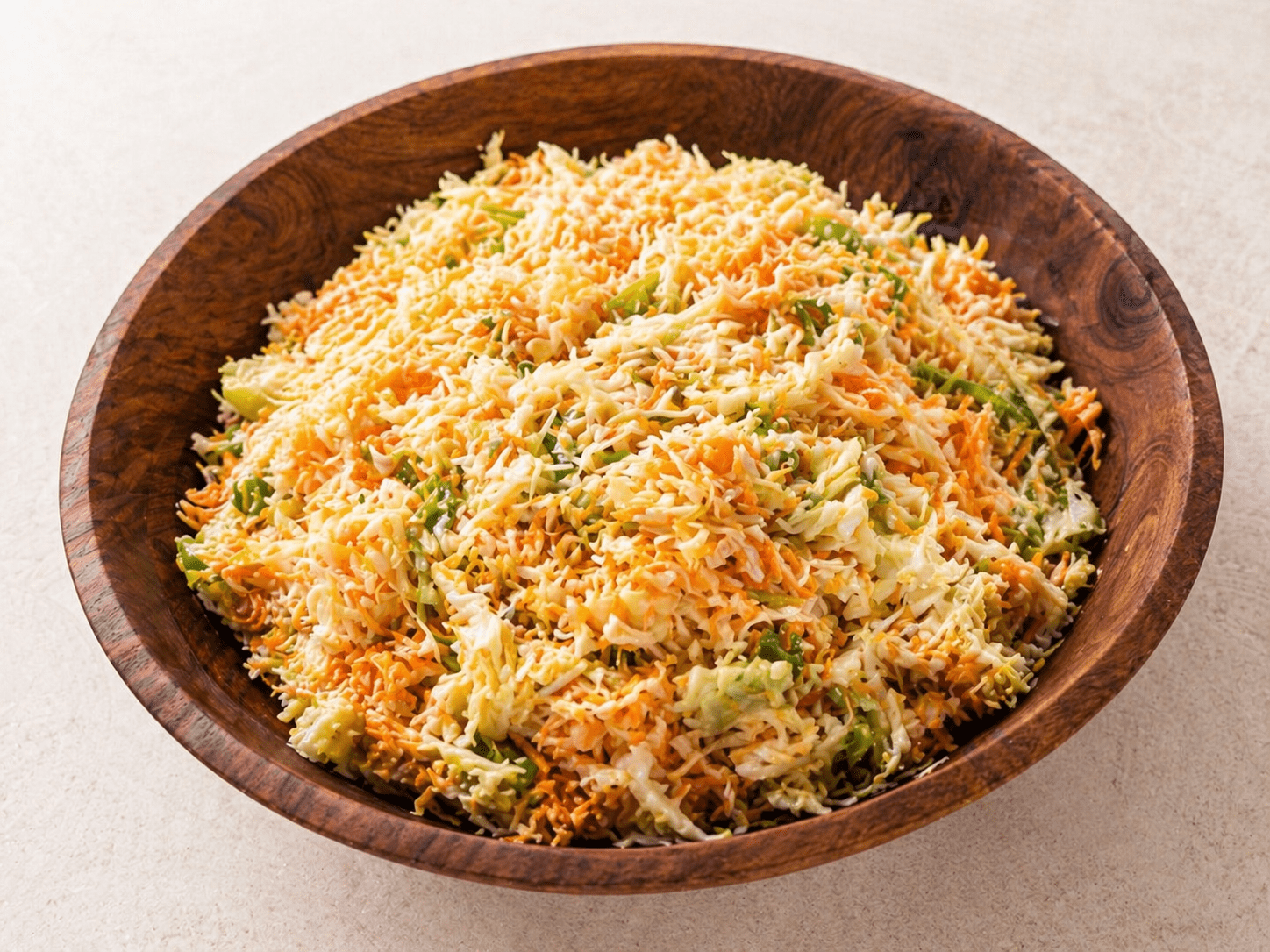 Coleslaw with homemade McDonald's sauce in a wooden bowl on a light background