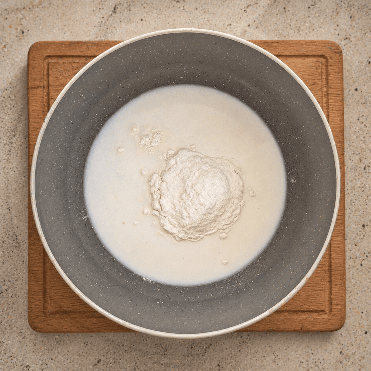 Tangzhong base being made — flour and milk combined in a pan before cooking