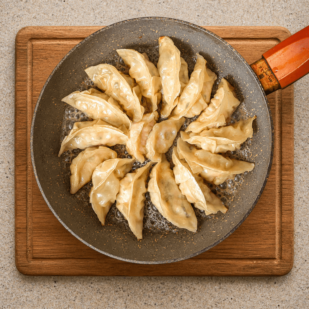 Raw gyoza arranged in a circular pattern in a non-stick pan, ready to be steam-fried