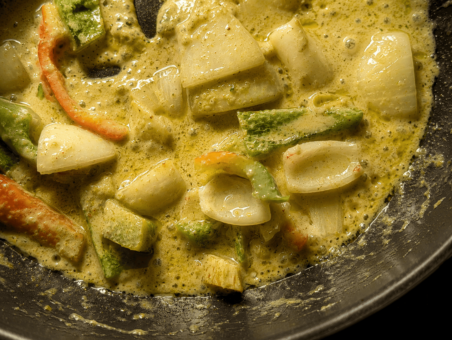 Green curry paste fried into coconut cream with vegetables until the fat separates into small bubbles